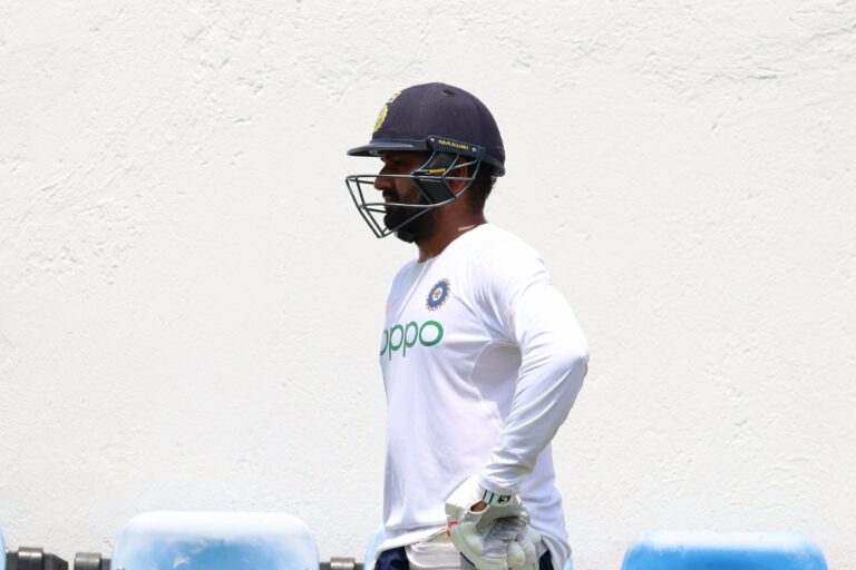 How can Rohit Sharma hold on to the opening position in Test cricket?